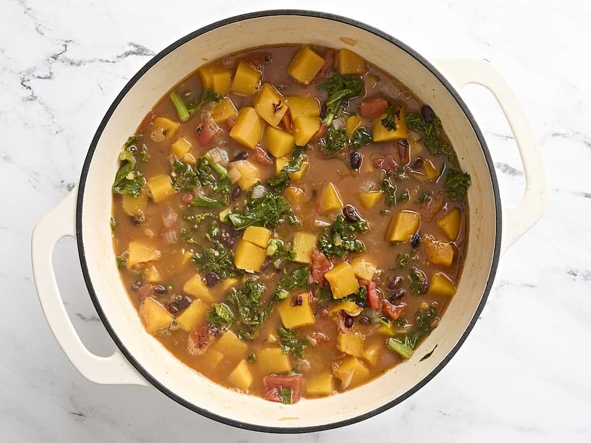 Butternut squash and black bean soup in a dutch oven.