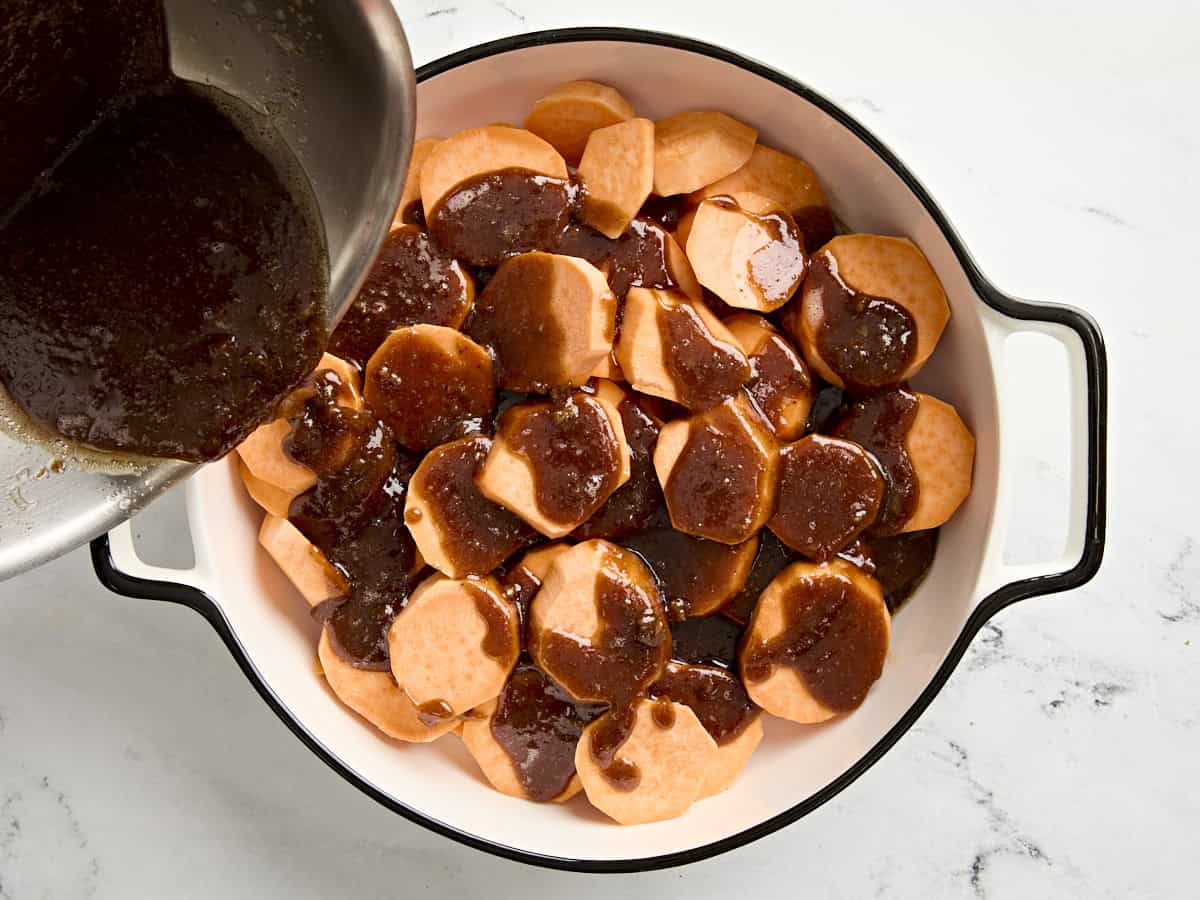 Glaze being poured over candied yams.