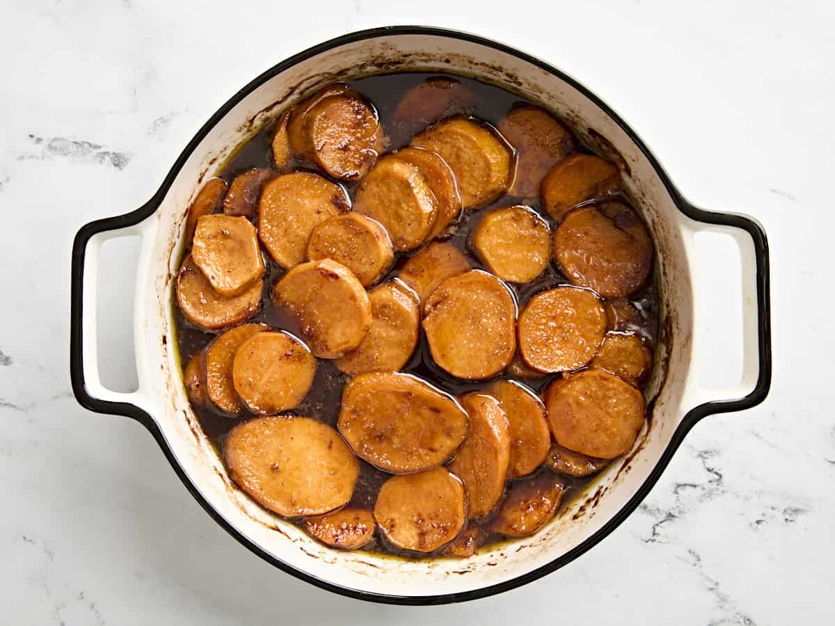 Cooked candied yams in a baking dish.