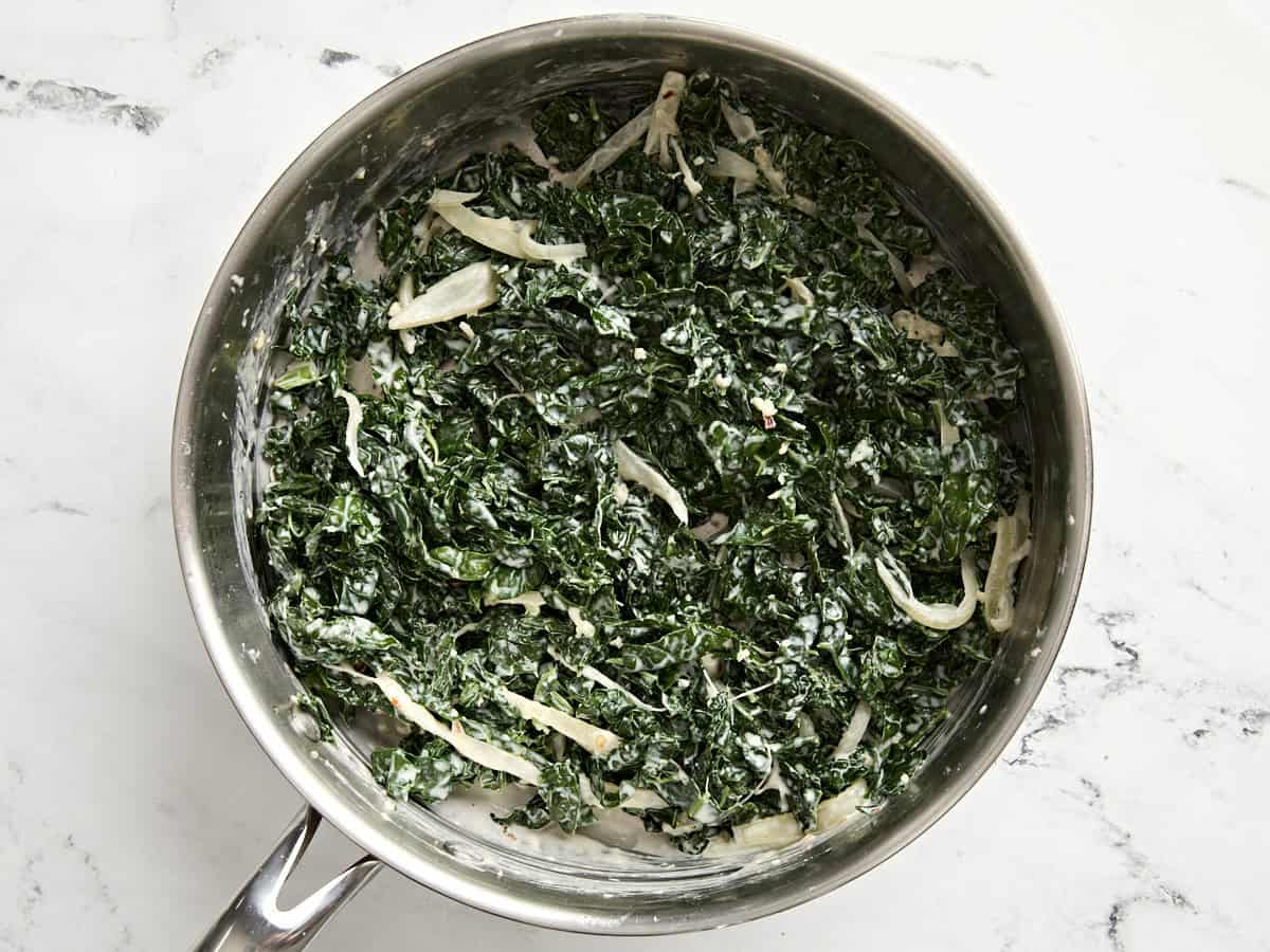 Finished creamed kale in a skillet.