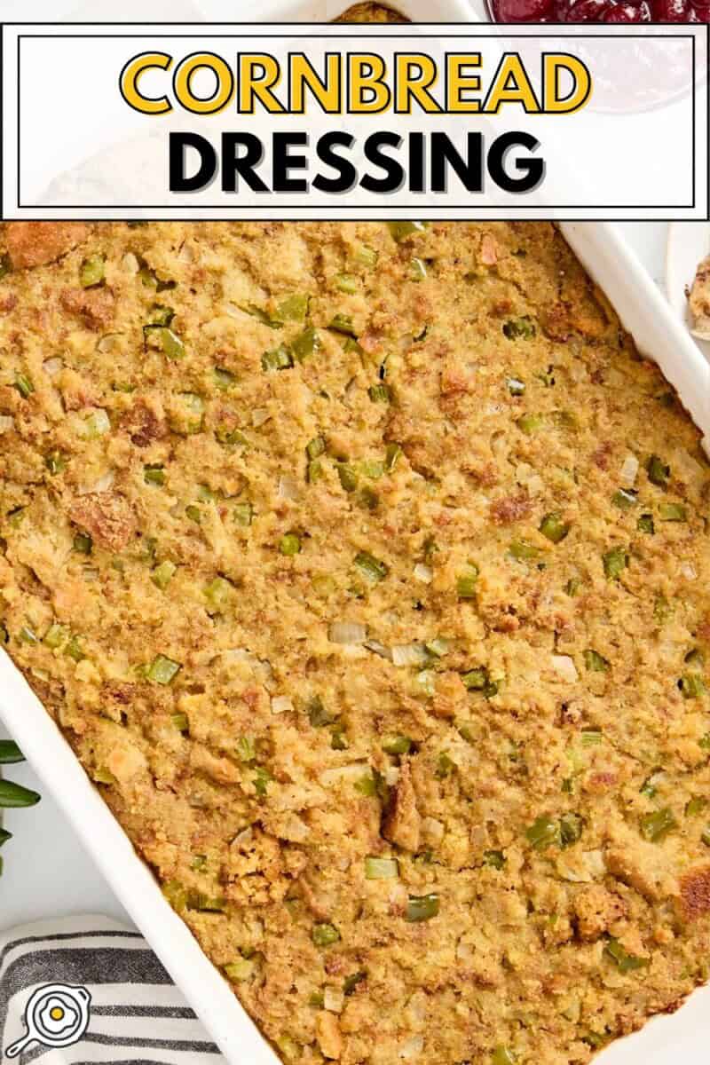 Overhead view of cornbread dressing in a large white baking dish with title text at the top.