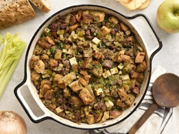 Overhead view of sausage stuffing in a casserole dish.