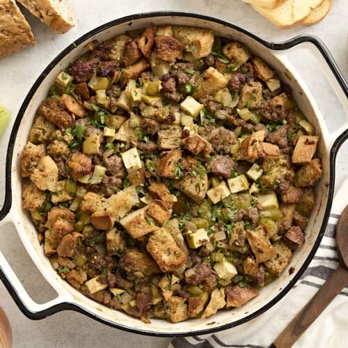 Overhead view of sausage stuffing in a casserole dish.