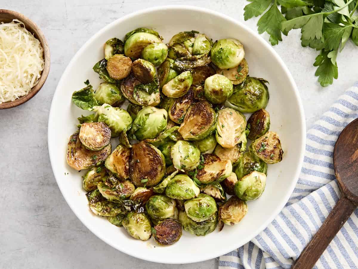 Overhead view of sauteed brussels sprouts in a bowl.