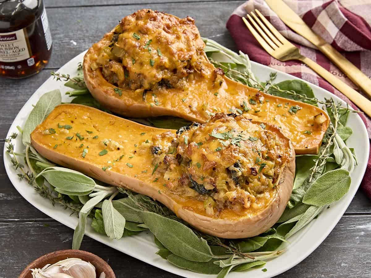 Side view of stuffed butternut squash on a plate.