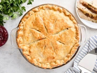 Overhead view of a turkey pot pie in a pie pan.