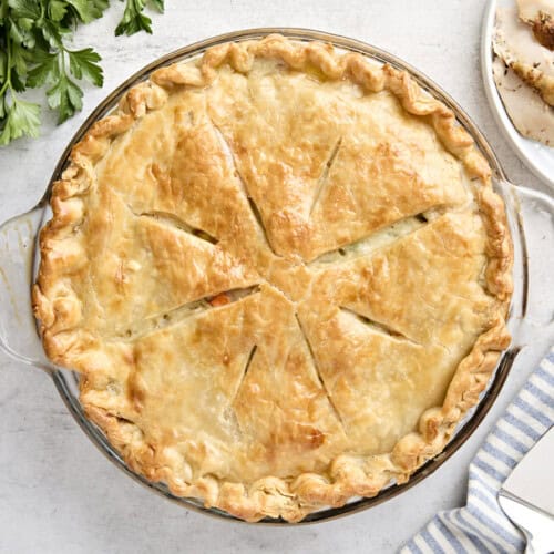 Overhead view of a turkey pot pie in a pie pan.