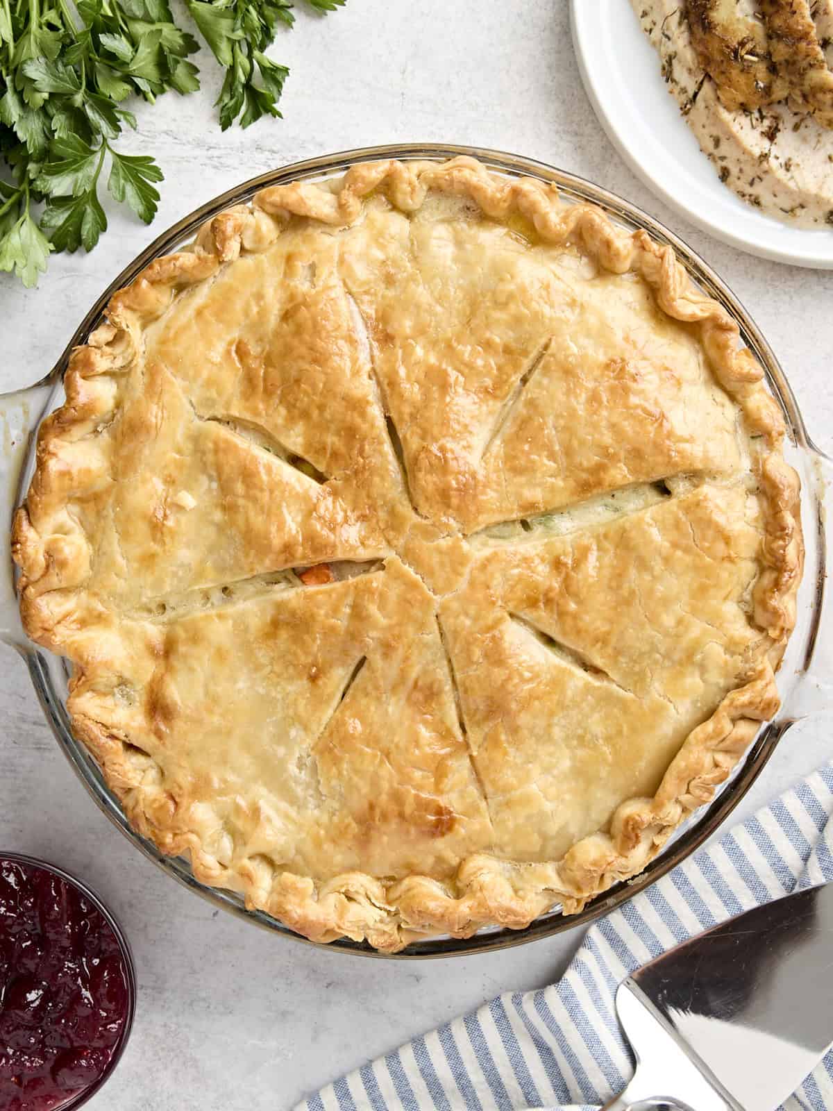 Overhead view of a turkey pot pie in a pie pan.