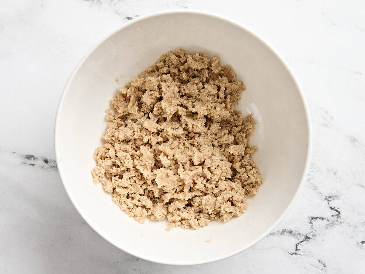 Streusel crumb topping for apple cinnamon muffins in a bowl.