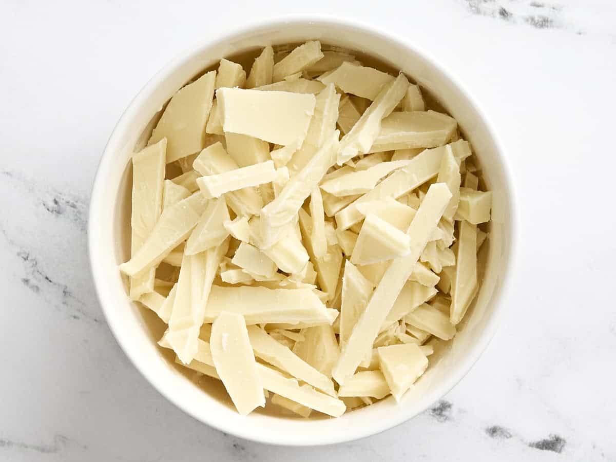 Chopped white chocolate in a bowl.