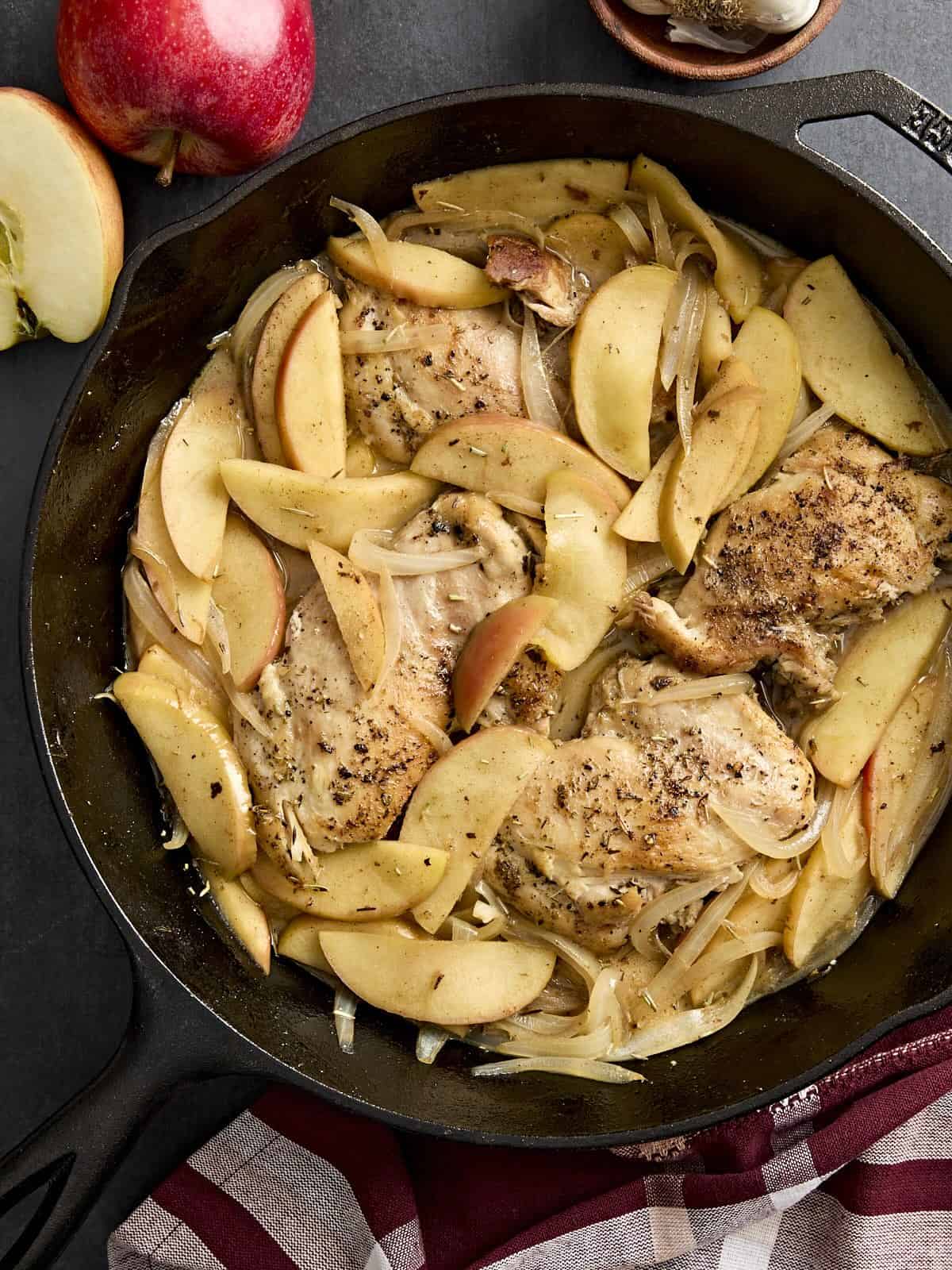 Overhead view of a chicken and apple skillet one pan dinner.