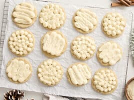 Overhead view of eggnog cookies on a parchment lined cooling rack.