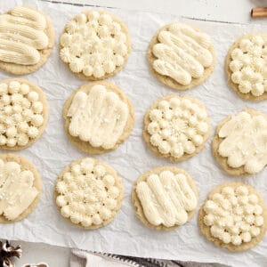 Overhead view of eggnog cookies on a parchment lined cooling rack.