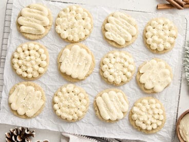 Overhead view of eggnog cookies on a parchment lined cooling rack.