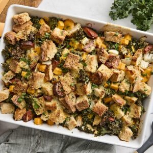 Overhead view of a savory bread pudding in a baking dish.