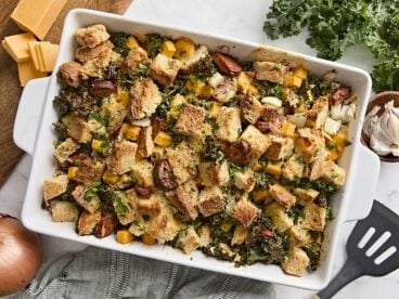 Overhead view of a savory bread pudding in a baking dish.