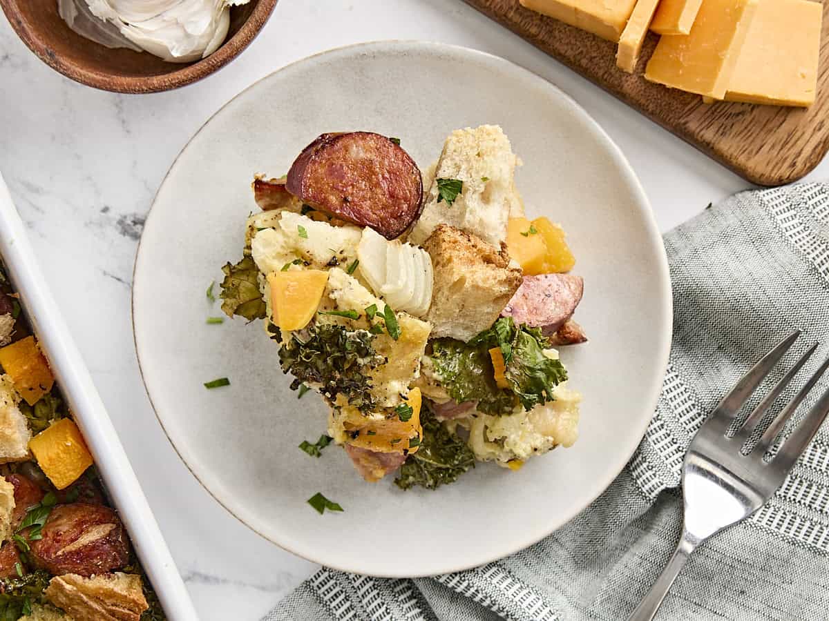 Overhead view of a slice of savory bread pudding.