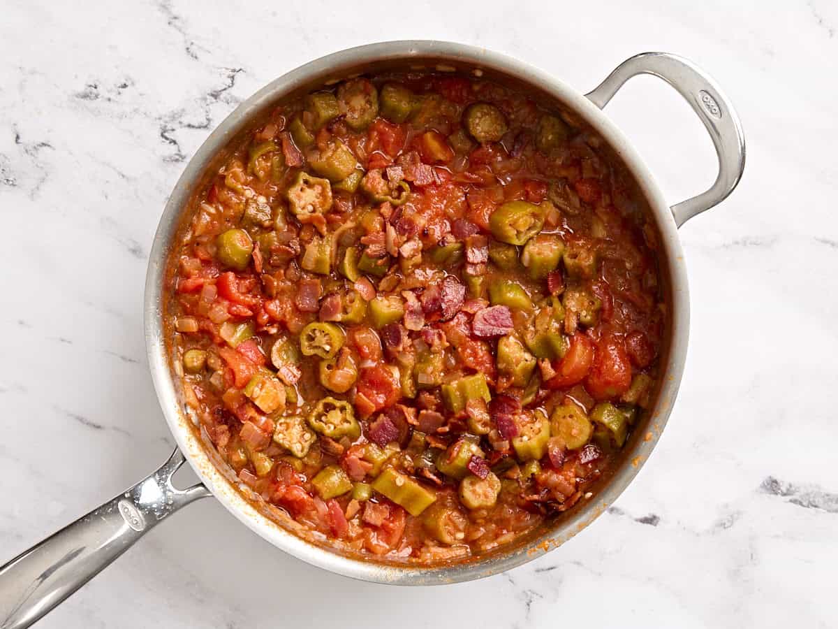 Finished stewed tomatoes and okra in a skillet.